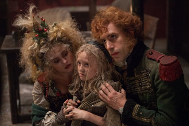 Still of Helena Bonham Carter, Sacha Baron Cohen and Isabelle Allen in Les Misérables